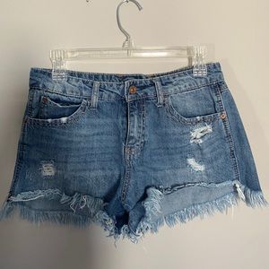 Blue ripped jean shorts